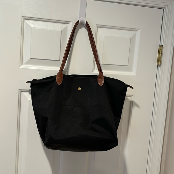 Longchamp Handbags - Black long champ shoulder bag. Has been worn and lots of wear and tear.